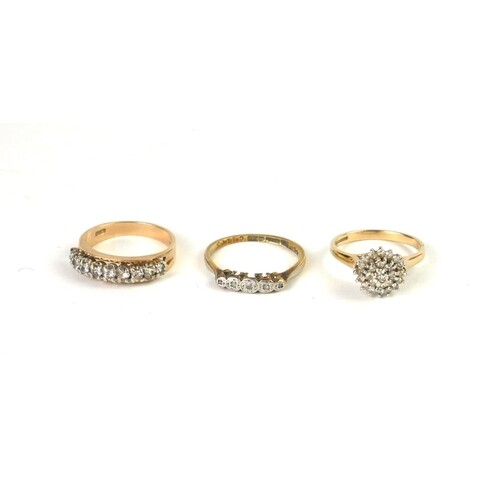 AN EARLY 20TH CENTURY 18CT GOLD AND DIAMOND FIVE STONE RING...