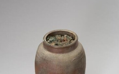 AN INTERESTING CERAMIC AMPHORA FILLED WITH COINS