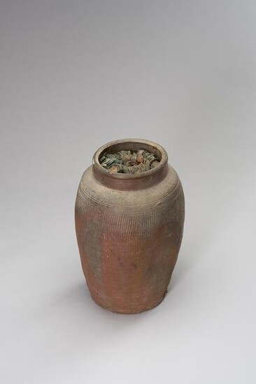 AN INTERESTING CERAMIC AMPHORA FILLED WITH COINS