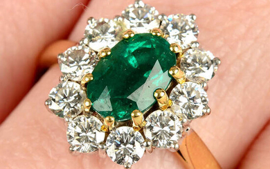 An 18ct gold emerald and brilliant-cut diamond cluster ring, by Cropp & Farr.