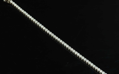 An 18ct white gold diamond set line bracelet