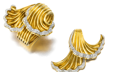 An 18k gold and diamond bangle bracelet