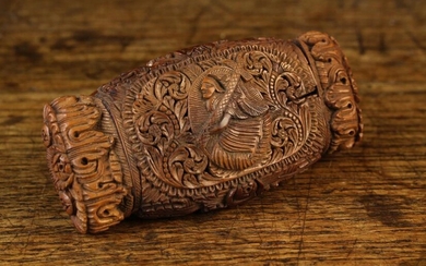 An 18th Century Carved Coquilla Nut Snuff Box. The hinged rectangular cushion lid centred by a raise