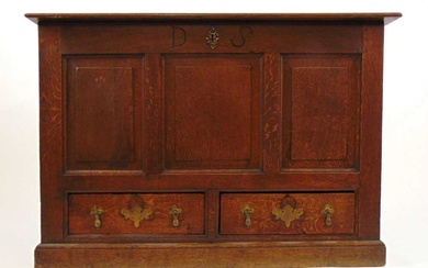 An 18th century and later oak mule chest, the moulded...