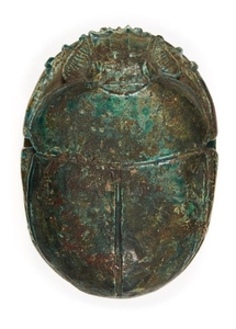 An Egyptian revival ware green-glazed stone scarab,...