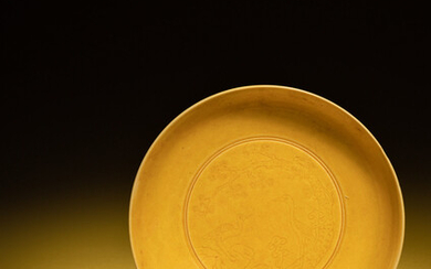 An Incised Yellow Glazed Porcelain 'Cranes and Pines' Plate
