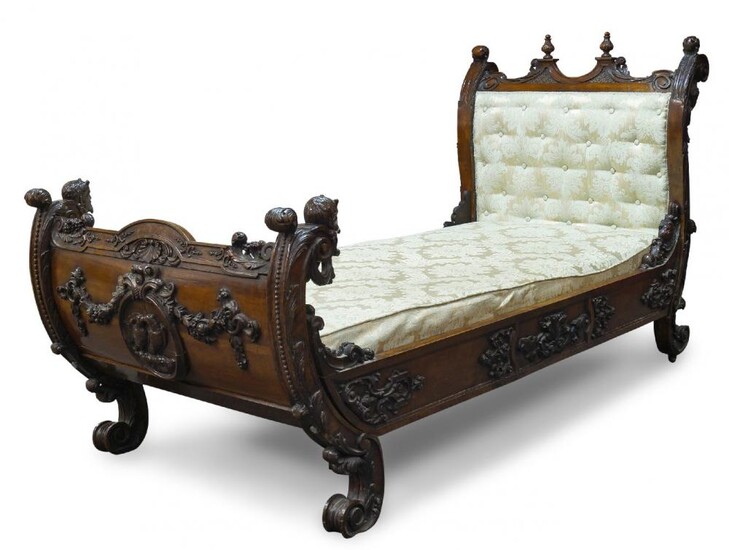 An Italian carved walnut day bed, late...