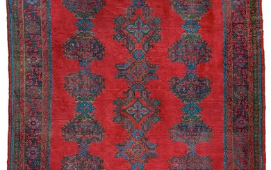 An Ushak 'Turkey Red' carpet, West Anatolia, circa 1900.