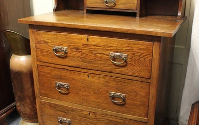 An early 20th century Arts and Crafts oak chest of drawers