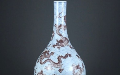 An exquisite blue and white underglaze red dragon pattern vase