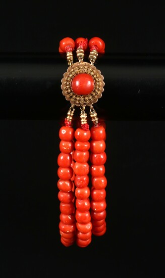 Antique red coral bracelet with gold lock.
