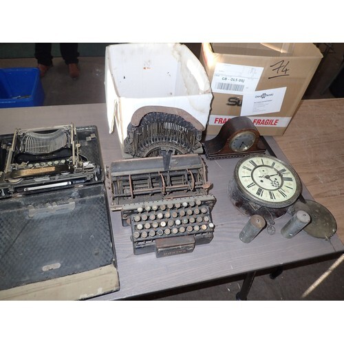 Antique typewriters and a clock face/mechanism ect.