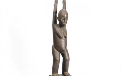 Burkina Faso, Lobi, standing female figure with arms raised.