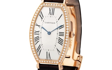 Cartier. Very Rare Tonneau-Shape Wristwatch in Pink Gold and Diamonds, Silver Roman Numbers Dial, Box and Papers