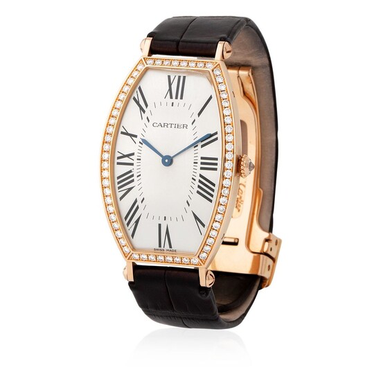 Cartier. Very Rare Tonneau-Shape Wristwatch in Pink Gold and Diamonds, Silver Roman Numbers Dial, Box and Papers