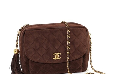 NOT SOLD. Chanel: A "Zip Camera Bag" of brown quiltet suede with one large compartment,...