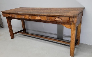 Circa 1890's Solid Oak Slanted Work Table with four storage drawers. Top and base comes in two