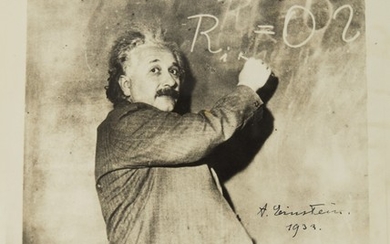 [EINSTEIN, ALBERT] | AN EXCEPTIONAL SIGNED PHOTOGRAPH OF EINSTEIN AT CHALKBOARD, 1931, SIGNED BY EINSTEIN