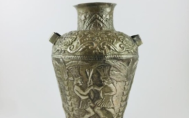 Embossed and chiselled hammered silver pitcher