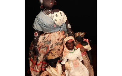 Folk Art - an early 20th century black cloth rag doll, proba...