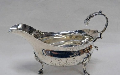 GEORGE III SILVER SAUCE BOAT WITH SCROLL HANDLE ON PAD FEET,...