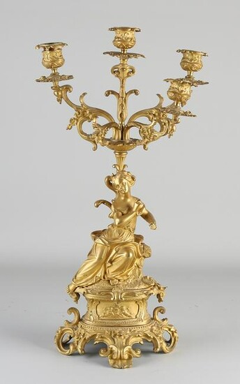 Heavy fire-gilt bronze candlestick with a woman.&#160