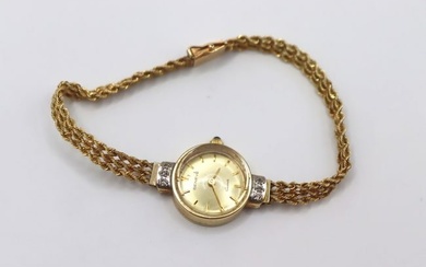 JEWELRY Lady's Geneve 14kt Gold and Diamond Watch.