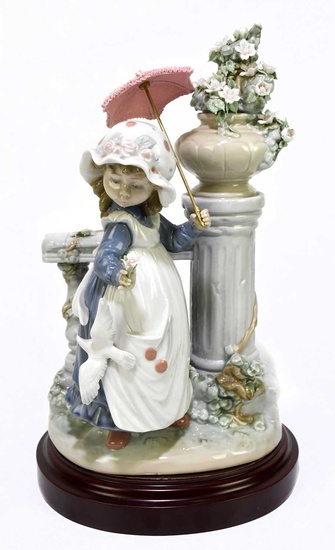 LLADRO; a figure of a girl with a parasol bedside...