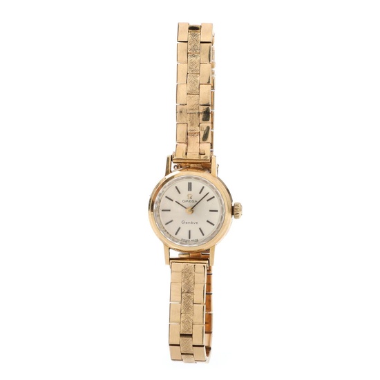 Omega A wristwatch of 14k gold. Model Genève. Mechanical movement with manual...