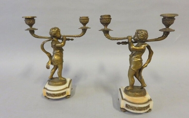 Pair of candlesticks in gilt bronze and white...