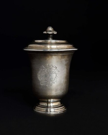 Plain silver blush pot stamped with a wedding coat of arms surmounted by a helmet resting on a pedestal, the neck threaded. The lid with a doucine and the leafy socket. MONTPELLIER 1755 (letter D) Master goldsmith: Marc BAZILLE received Master in 1732...