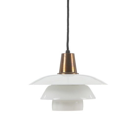 Poul Henningsen: “PH 3/3”. Pendant with sockethouse of brass. Shades of opal glass, later middle shade.