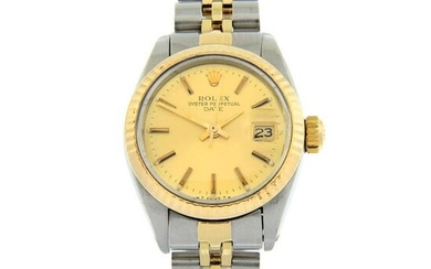 ROLEX - an Oyster Perpetual Date bracelet watch. Circa 1980. Stainless steel case with yellow metal