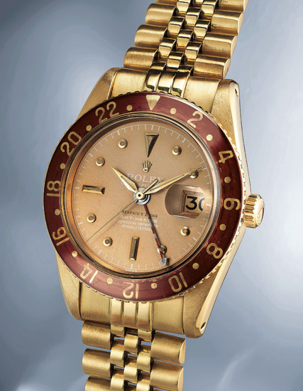Rolex, Ref. 6542 A highly exclusive, important and exceptionally well-preserved yellow gold dual time wristwatch with date, bakelite bezel and bracelet