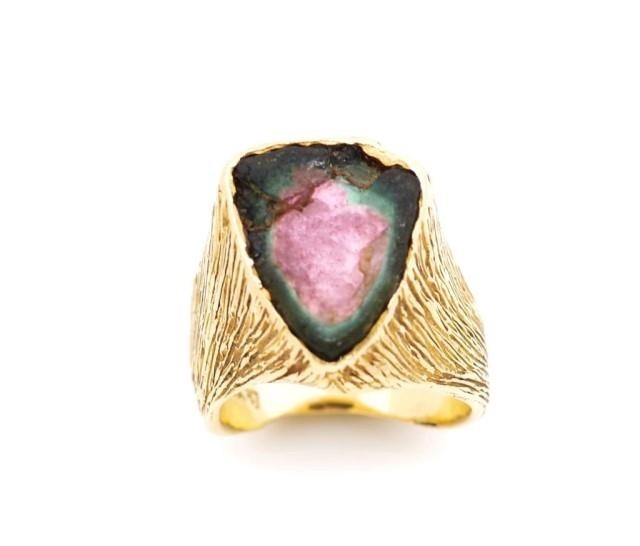 Rough cut gemstone and 18ct yellow gold ring tests as waterm...