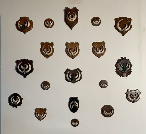 Set of nineteen hunting trophies made up of...