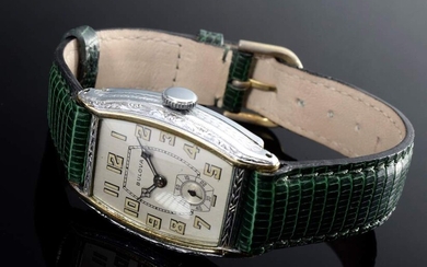 Steel/YG 585 edition Art Deco Bulova wristwatch, manual winding, arabic numerals, minute indices, blued hands, small second at 6, tonneau form, case no. 9538869, green lizard leather strap, 3,7x2,7cm, operable (no guarantee on movement and...
