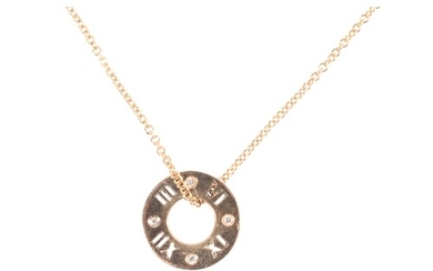 TIFFANY & CO: ATLAS A GOLD PENDANT NECKLACE the ring pendant...