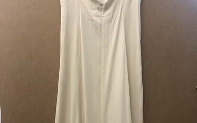 TWO VINTAGE OFF-WHITE LONG SLEEVELESS DRESSES. Estimate $40-60