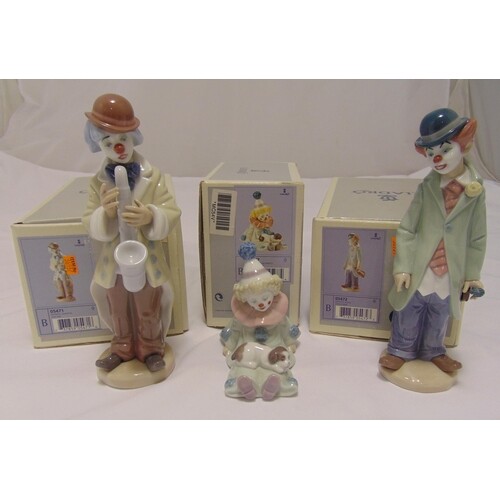 Three Lladro figurines of clowns in different poses all in o...