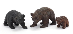 Three carved Black Forest bears, the largest 20cm in length