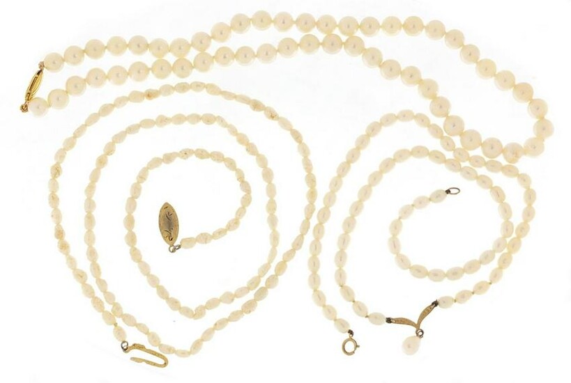 Three single string pearl necklaces including two with