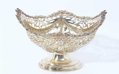 Victorian silver gilt bon bon dish of navette form, with embossed swags and pierced decoration raised on oval pedestal foot, (Chester, marks rubbed), 6.4ozs, 15cm in length