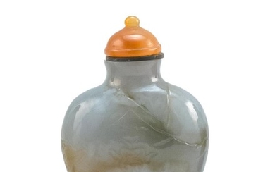 CHINESE GREEN, WHITE AND BROWN JADE SNUFF BOTTLE In spade shape, with flower and mountain landscape design. Height 2". Agate stopper.