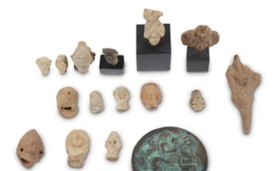 A collection of Assyrian, Hellenistic, and Roman terracotta figure...