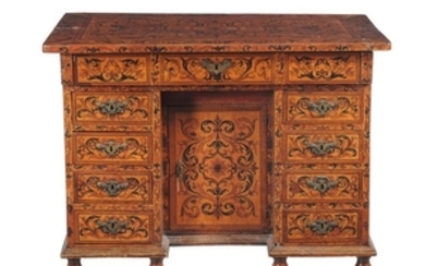 A Continental sycamore marquetry inlaid knee hole desk, circa 1700