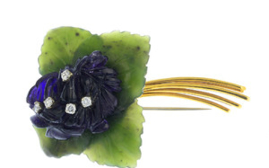 A diamond and gem-set floral brooch. View more details