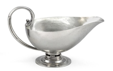 GEORG JENSEN STERLING SILVER GRAVY/SAUCE BOAT #303, designed by Johan Rohde in 1919. In helmet form with scrolled and beaded handle...
