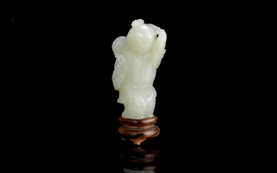 A pale green jade carving of a boy