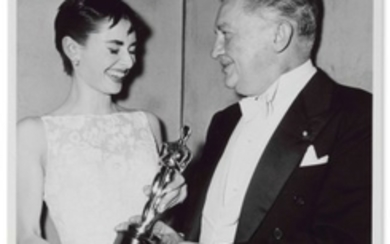 ROMAN HOLIDAY, 1953 TOMMY WEBER, Audrey Hepburn holding her Academy Award for Best Actress for Roman Holiday with presenter Jean Hersholt at the 26th Academy Awards, New York, 25 March, 1954